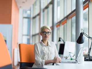 Image showing businesswoman using a laptop in startup office