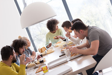 Image showing multiethnic group of happy friends lunch time