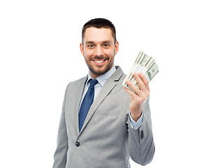 Image showing smiling businessman with american dollar money