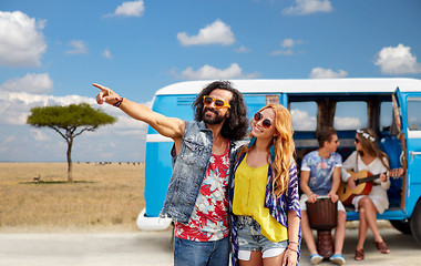 Image showing happy hippie couples and minivan in africa