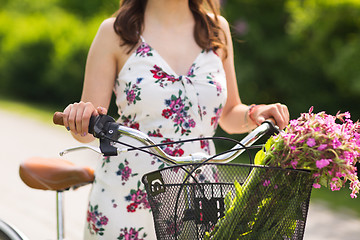 Image showing close up of woman with fixie bicycle in park