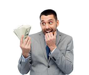 Image showing smiling businessman with american dollar money