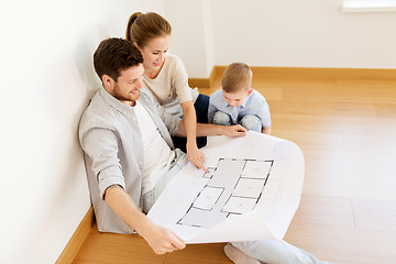 Image showing happy family with blueprint moving to new home