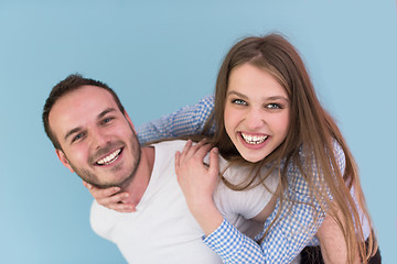 Image showing young man piggybacking his girlfriend