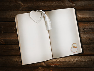 Image showing open book with heart bookmark