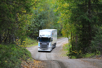 Image showing White Next Generation Scania Semi in Autumn Forest 