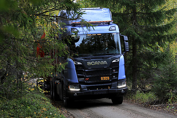 Image showing New Scania XT Logging Truck on Dirt Road