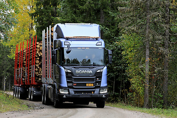 Image showing Scania R650 XT Logging Truck on Forest Road