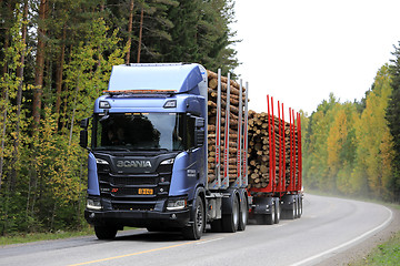 Image showing Scania R650 XT Logging Truck on Autumn Road