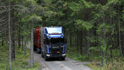 Image showing Scania R650 XT Logging Truck Emerges From Forest