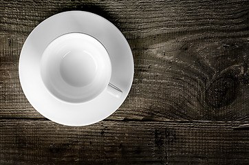 Image showing Empty coffee cup on wooden table