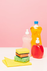 Image showing Various bottles with cleaning supplies on colored background