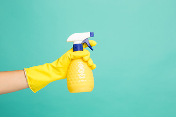 Image showing Close up picture of a house-cleaning spray on a blue background