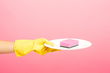 Image showing Hands in yellow protective gloves washing a plate