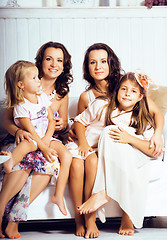 Image showing Mature sisters twins at home with little daughter, happy family