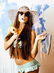 Image showing cute bright woman in sunglasses and hat with cocktail in bikini in studio