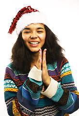 Image showing cute young girl in santas red hat isolated