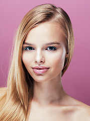Image showing young pretty blonde woman with hairstyle close up and makeup on pink 