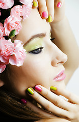 Image showing Beauty young real woman with flowers and make up closeup