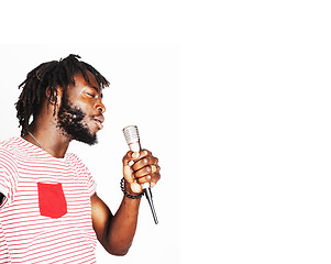 Image showing young handsome african american boy singing emotional with micro