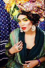 Image showing beauty bright woman with creative make up, many shawls on head l