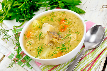 Image showing Soup fish with millet on light board