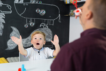 Image showing Cute little toddler boy at child therapy session.