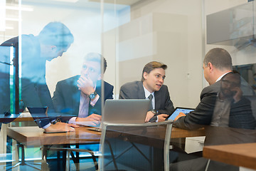 Image showing Business people sitting and brainstorming at corporate meeting.