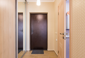 Image showing Entrance hallway, interior, entrance door, built-in wardrobes and an open door to the bathroom