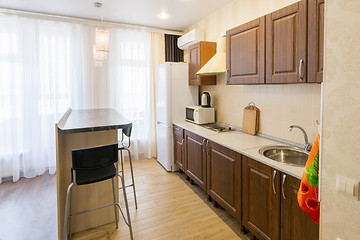 Image showing Kitchen interior with a bar counter in the apartment