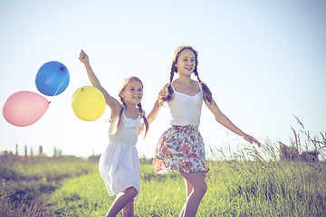 Image showing Happy little children playing in the field at the day time.