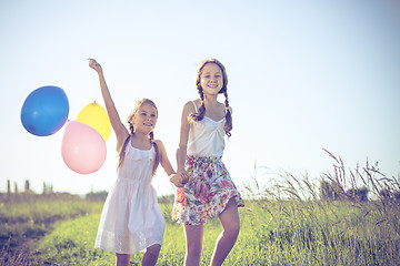 Image showing Happy little children playing in the field at the day time. 