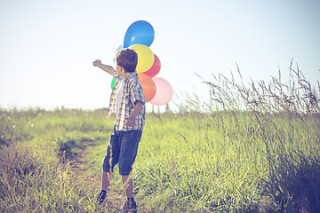 Image showing Happy little boy playing on road at the day time.