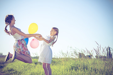 Image showing Happy little children playing in the field at the day time.