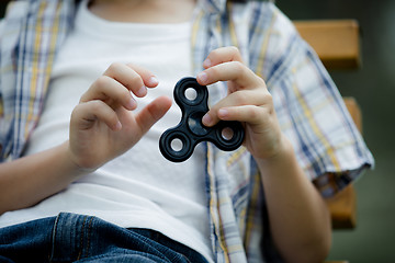 Image showing Happy little boy playing in the park at the day time.