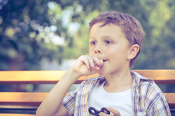 Image showing Happy little boy playing in the park at the day time.