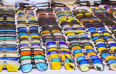 Image showing Colorful Sunglasses for sale at street market