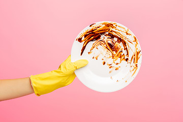 Image showing Hands in yellow protective gloves washing a plate