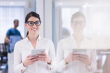 Image showing Business Woman Using Digital Tablet in front of startup Office