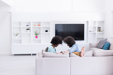 Image showing multiethnic couple in living room