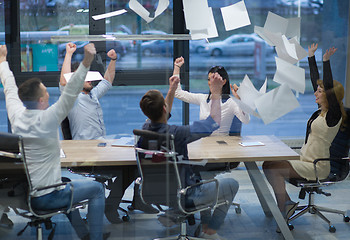 Image showing startup Group of young business people throwing documents