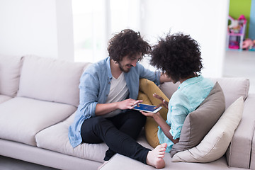 Image showing multiethnic couple in living room