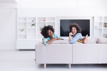 Image showing young multiethnic couple in living room