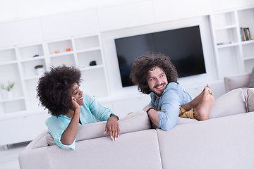 Image showing young multiethnic couple in living room