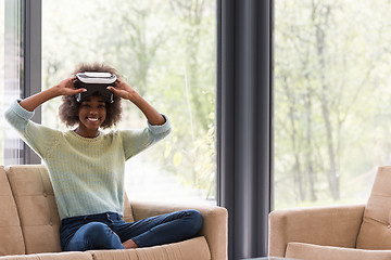 Image showing black woman using VR headset glasses of virtual reality