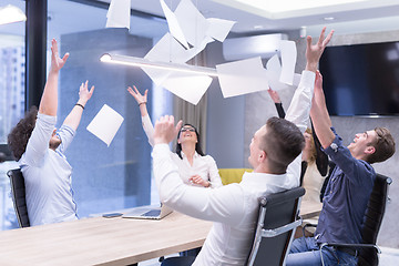 Image showing startup Group of young business people throwing documents