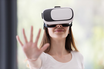 Image showing woman using VR-headset glasses of virtual reality