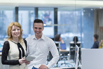 Image showing Business People Working With Tablet in startup office