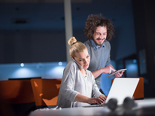 Image showing designers in the night startup office