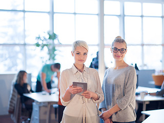 Image showing Pretty Businesswomen Using Tablet In Office Building during conf